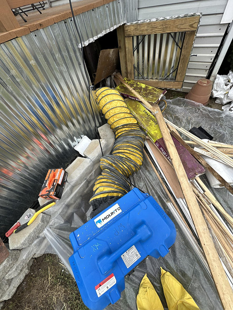 Water Pro Inc crawlspace ventilation setup during mold remediation project