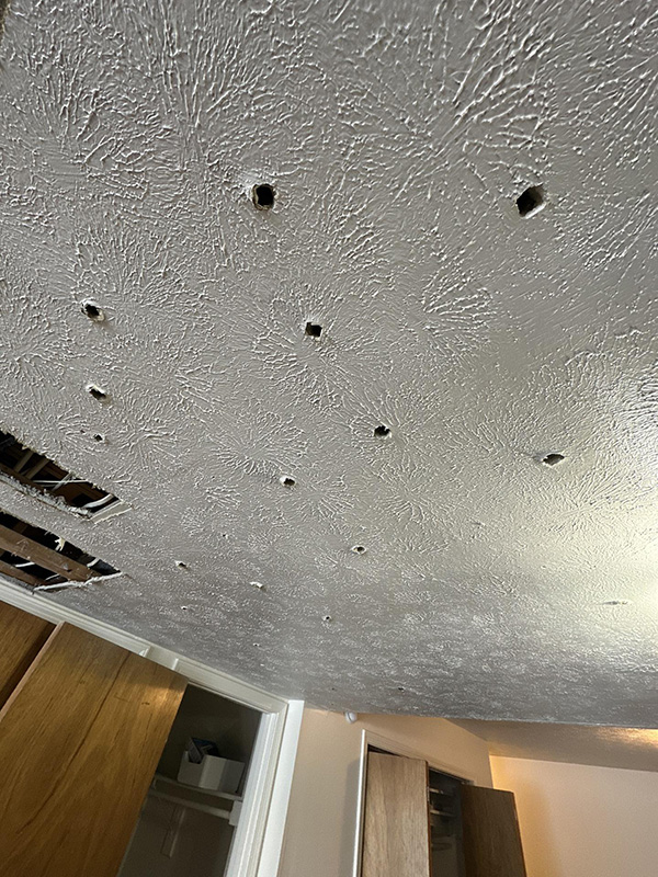 Ceiling Ventilation Holes Created For Basement Water Damage Drying Process