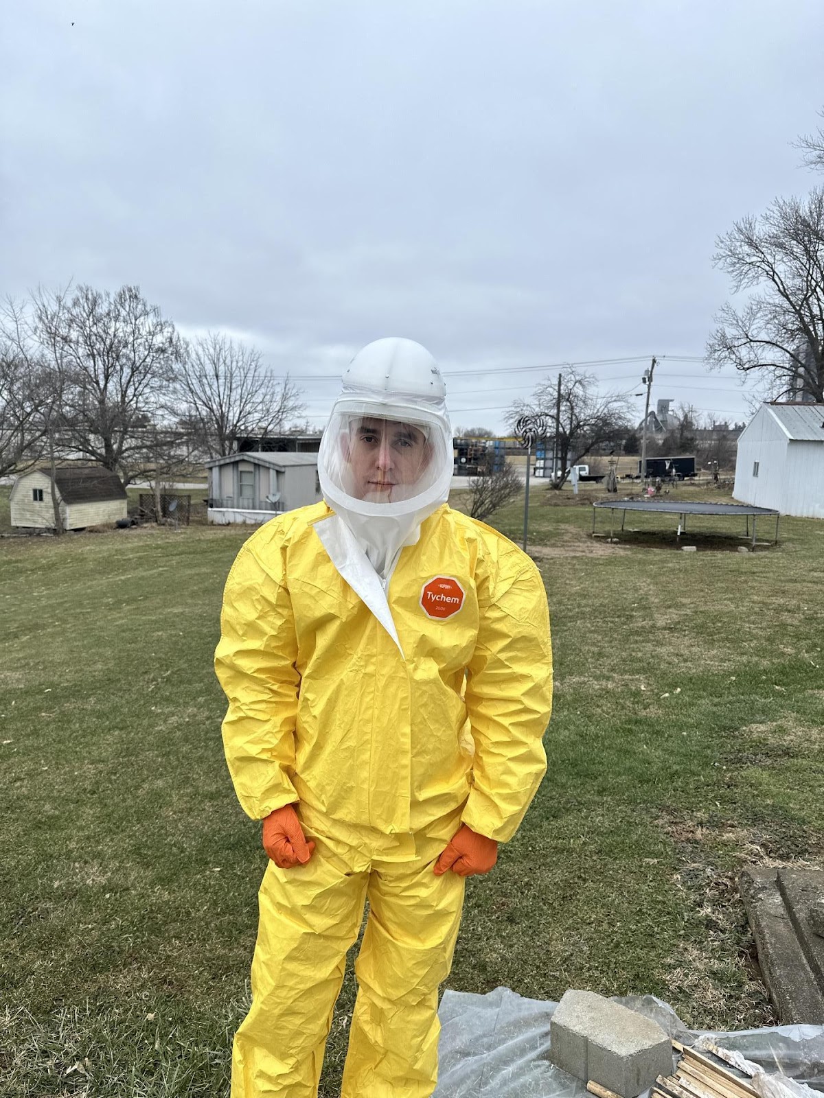 Water Pro Inc technicians in full PPE protective equipment setting up containment and drying systems during restoration in Bloomington Indiana